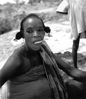 Fulani woman with a chew stick and forehead tattoo, Nigeria