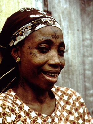 Yoruba woman with tribal tattoo marks on her face, Nigeria