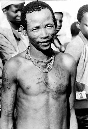 Sekele Bushman with Windhoek tattooed on his arm, Namibia