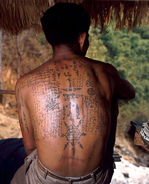 A modern Thai with protective tattoos, backside